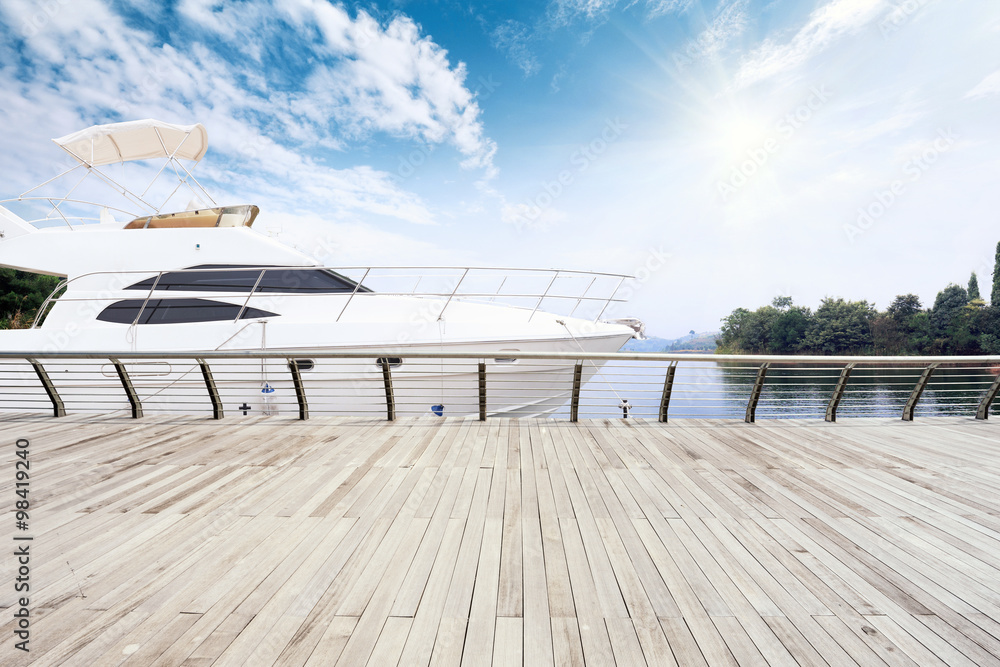 skyline wooden floor and yacht on lake