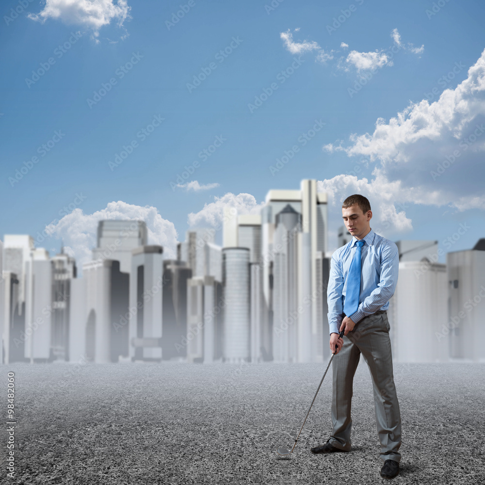 Businessman playing golf