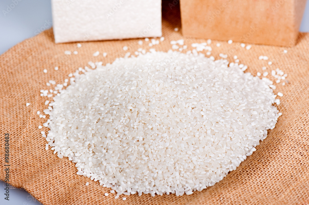 raw rice on wooden background