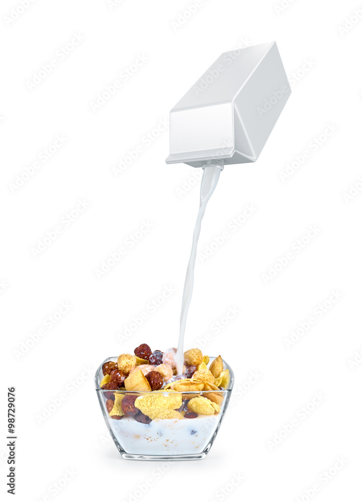 pouring milk into cornflakes bowl isolated on white