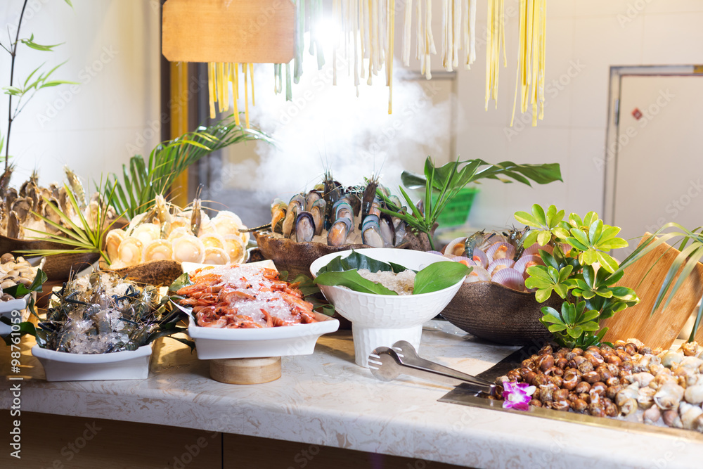 fresh seafood on table in cooking room