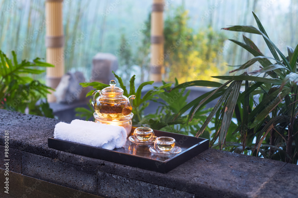 tea set on plate near spa pool