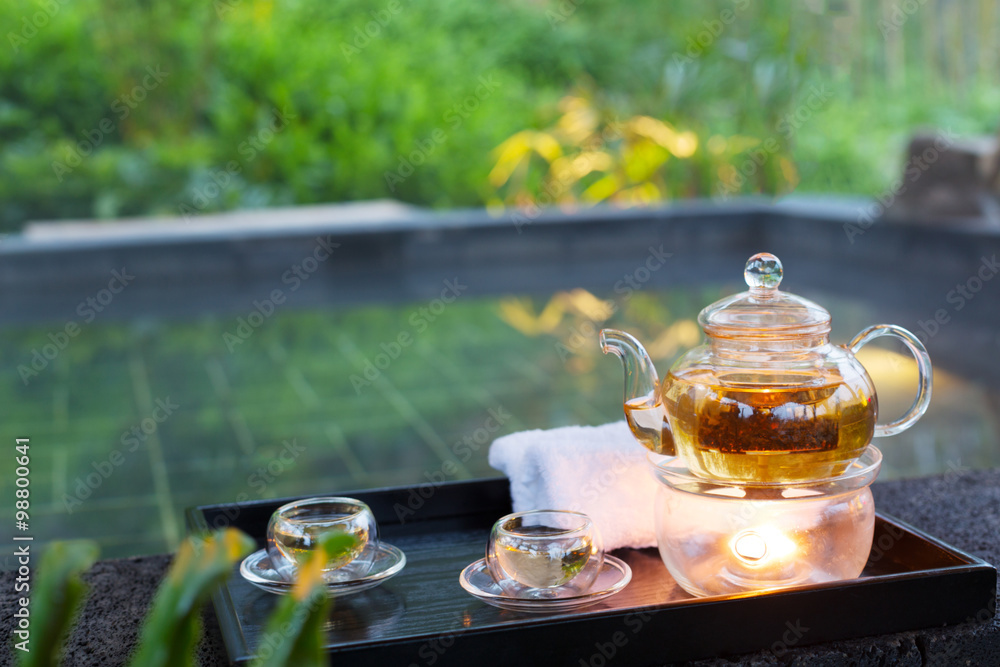 tea set on plate near spa pool