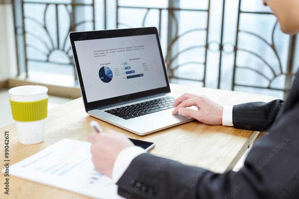 businessman checking financial reports