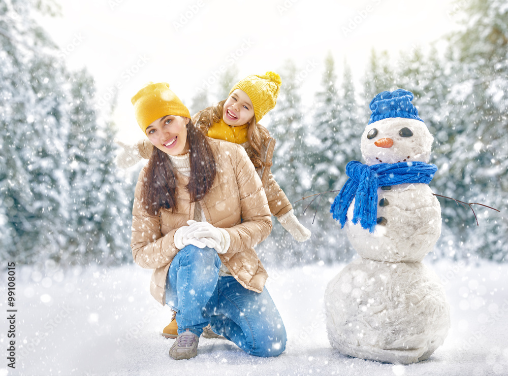 mother and child girl on a winter walk in nature