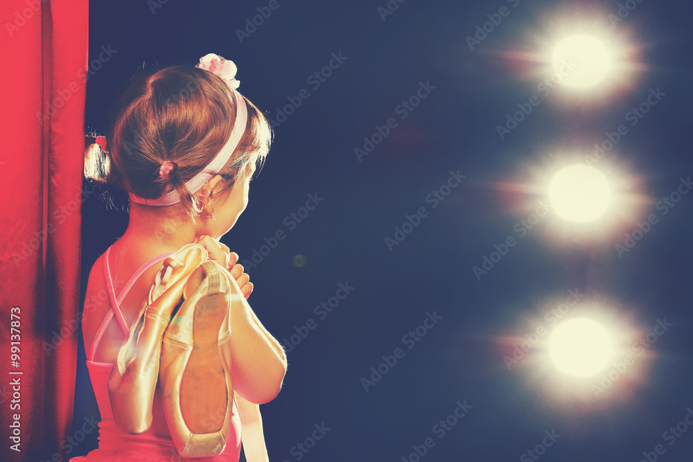 little girl ballerina ballet dancer on stage in red side scenes