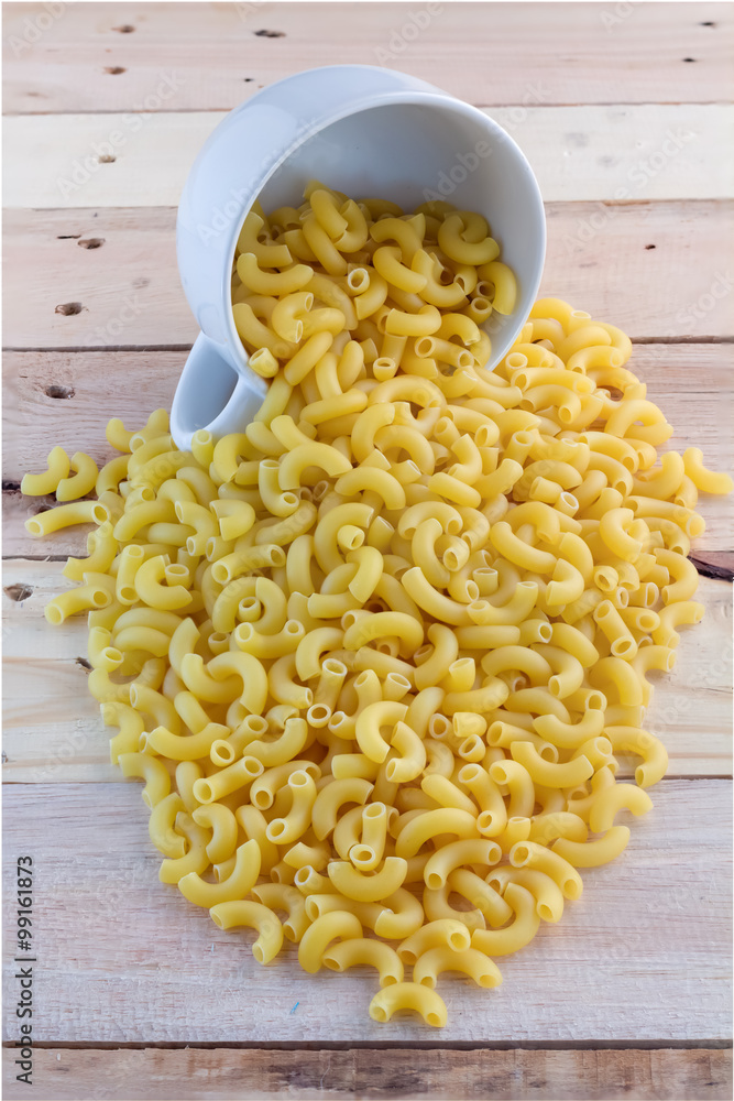 pasta macaroni  on wooden background.jpg