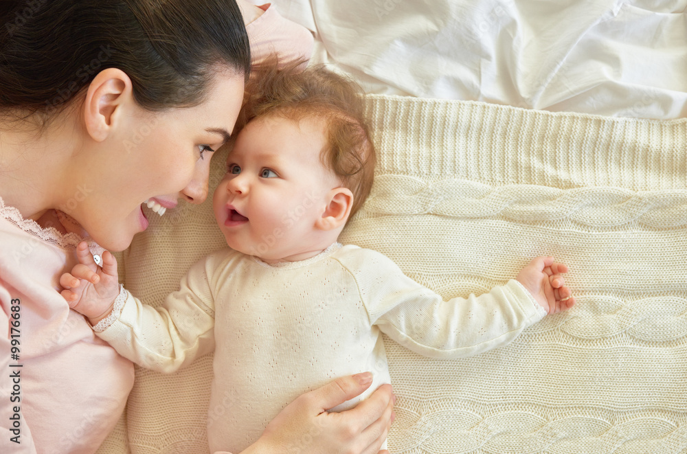 mother playing with her baby