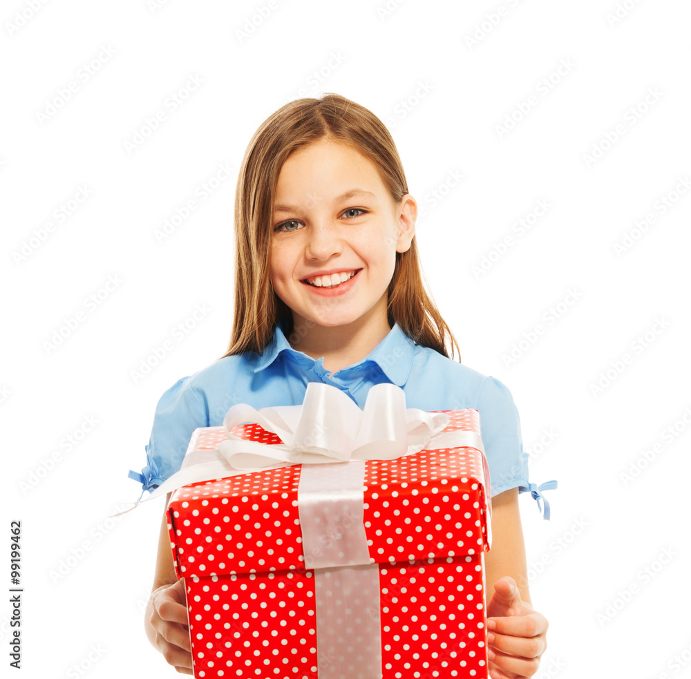 Happy little smiling girl with big present 