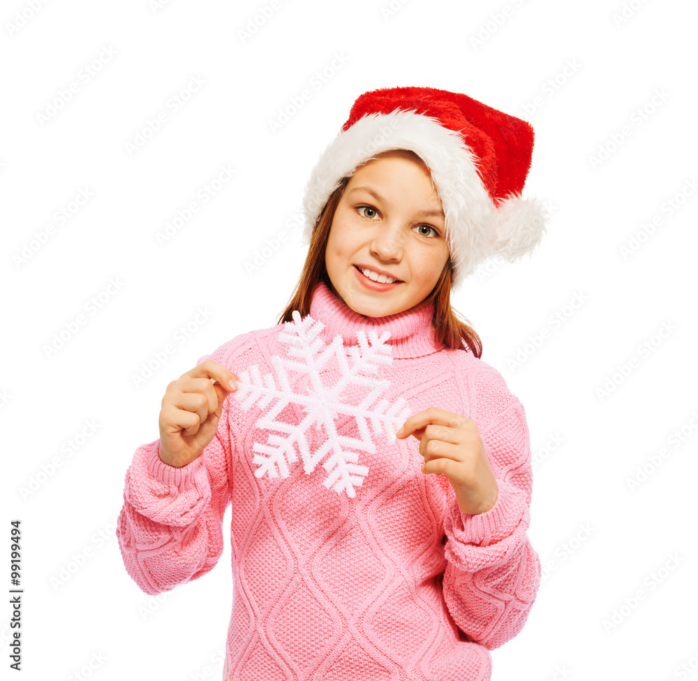 Beautiful girl hold snowflake wearing Santa cap