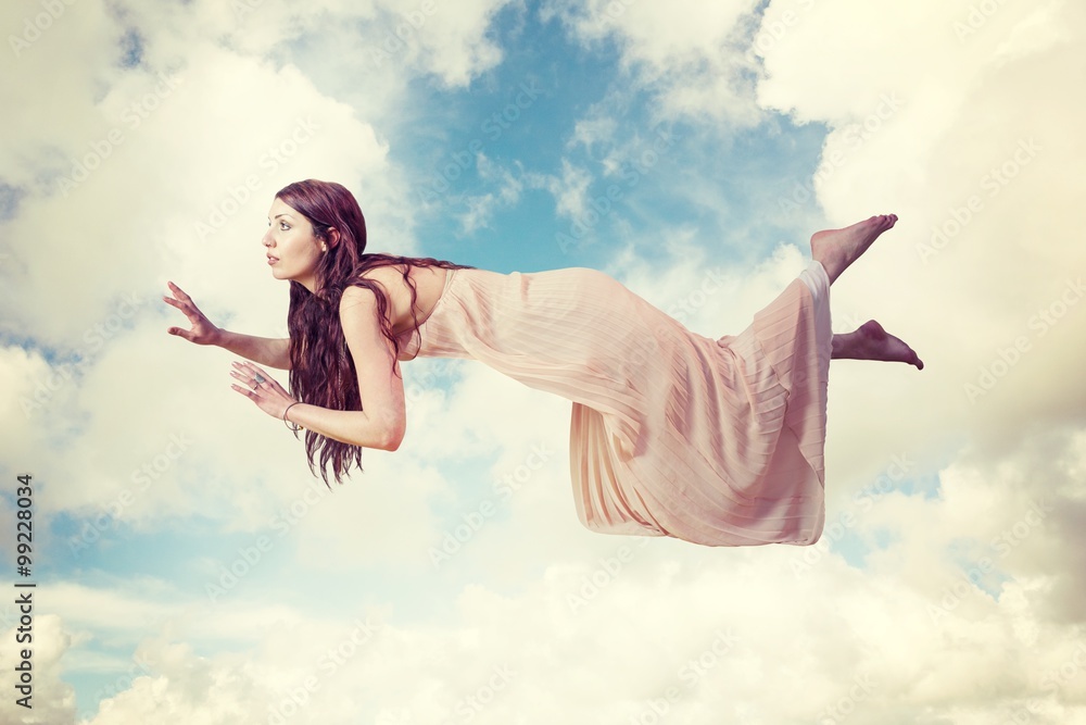 Composite image of full length of woman levitating 