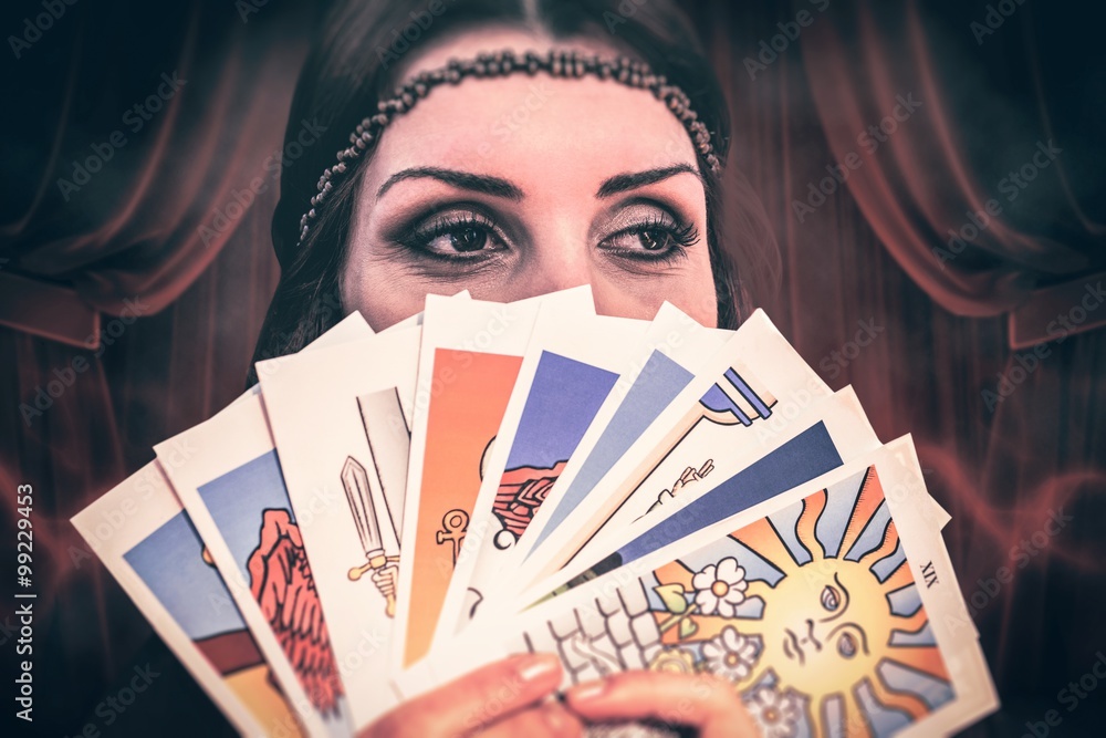 Fortune teller holding tarot cards