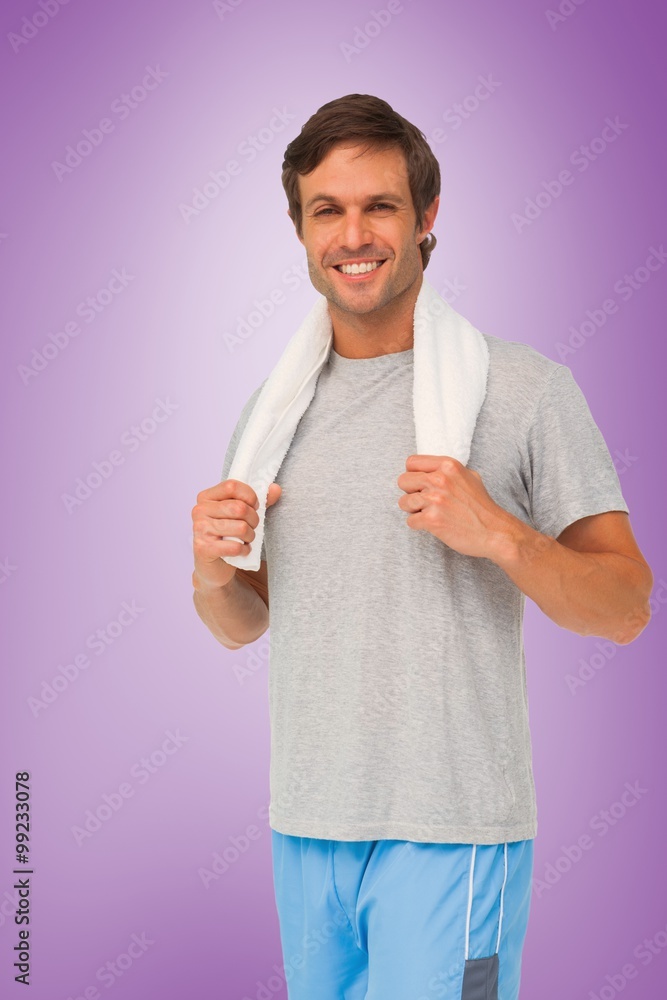 Composite image of portrait of a fit young man with towel