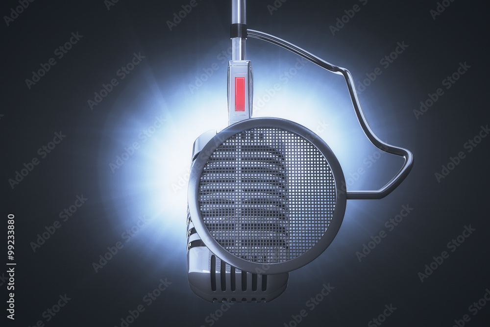 Old style microphone at speakers background