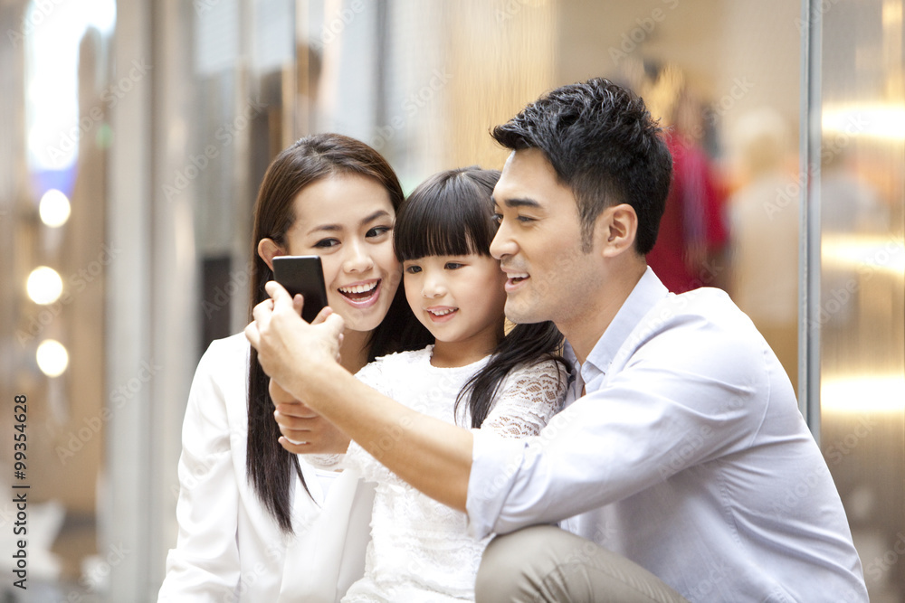 Young family doing self portrait photography in Hong Kong