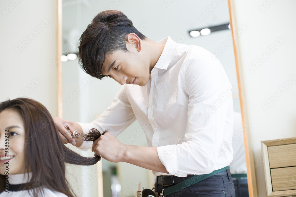 Barber cutting customers hair