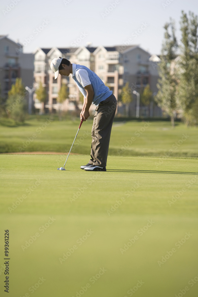 Golfer putting on the Green