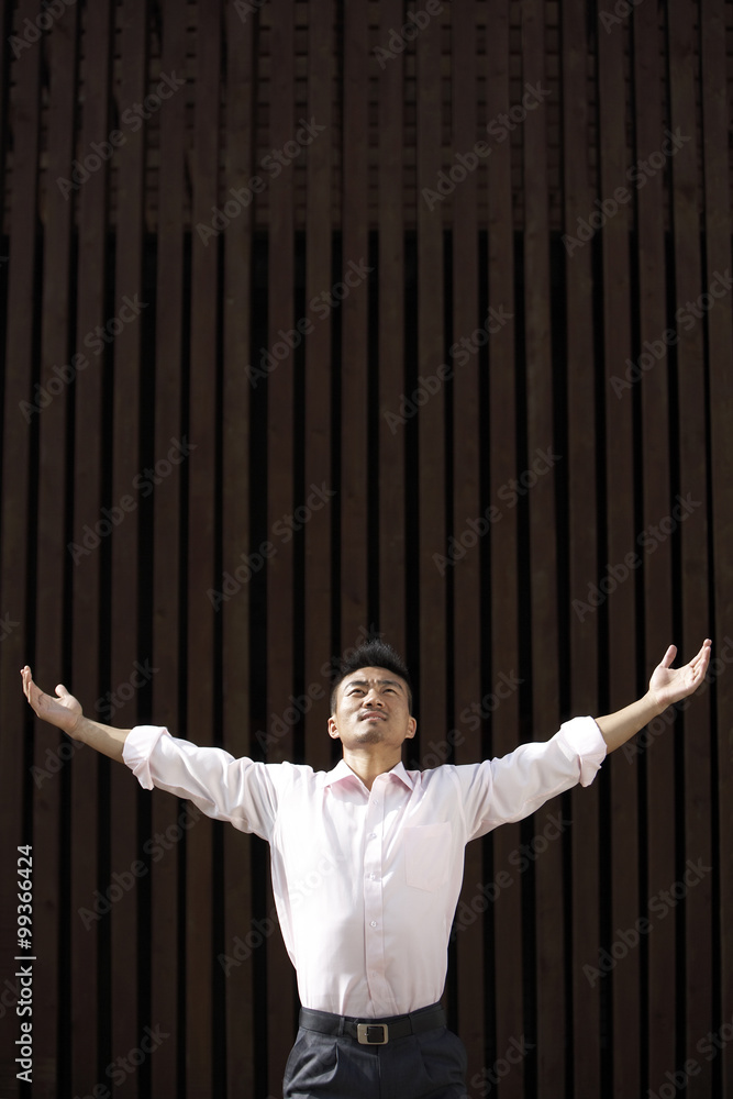 Man Standing Outdoors In Meditation Pose 