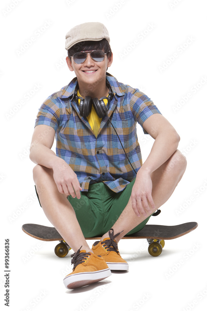 Cool young man with skateboard