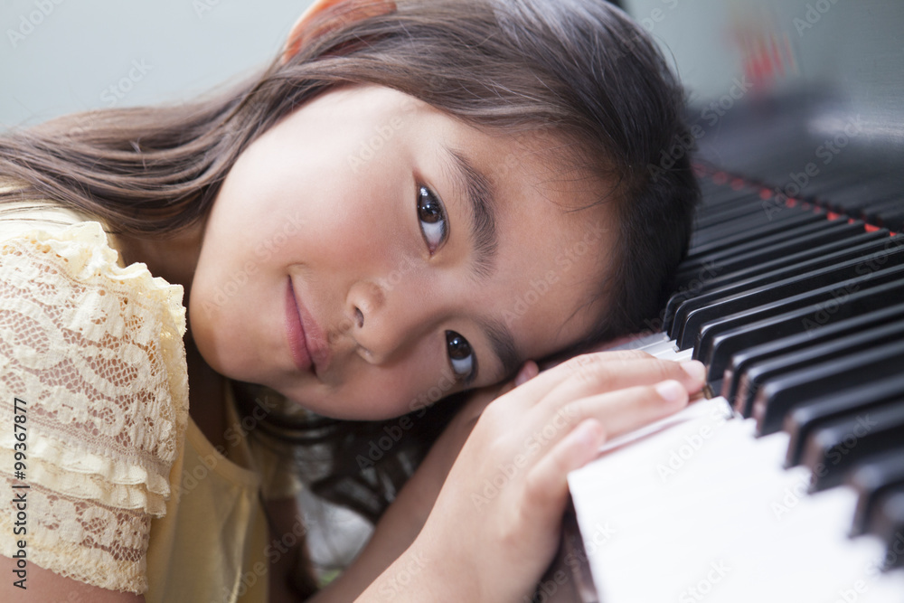 Little girl playing the piano