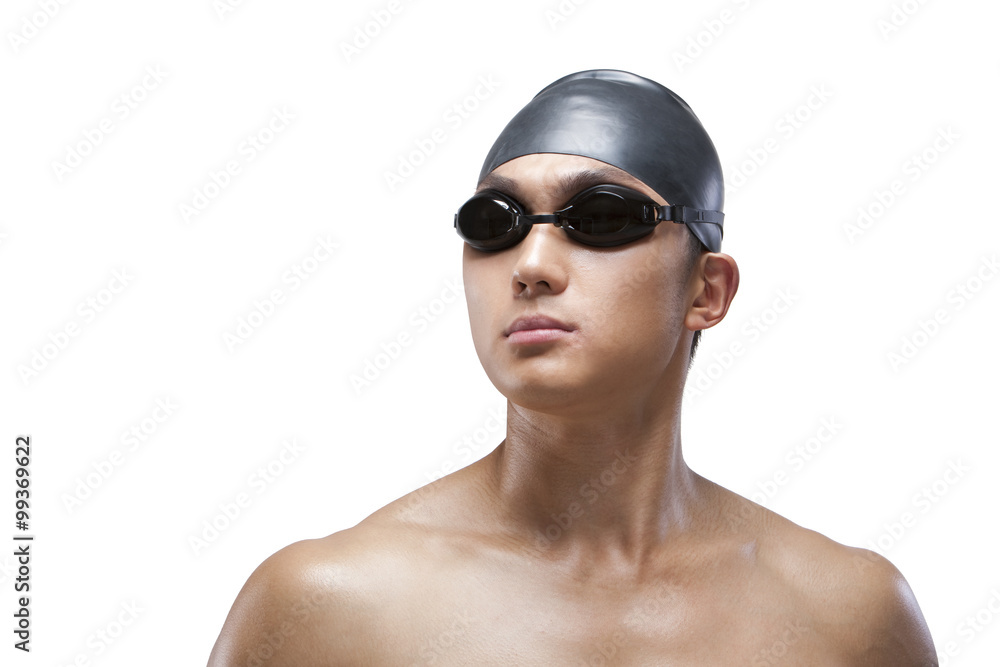 Swimmer with swimcap and goggles looking on