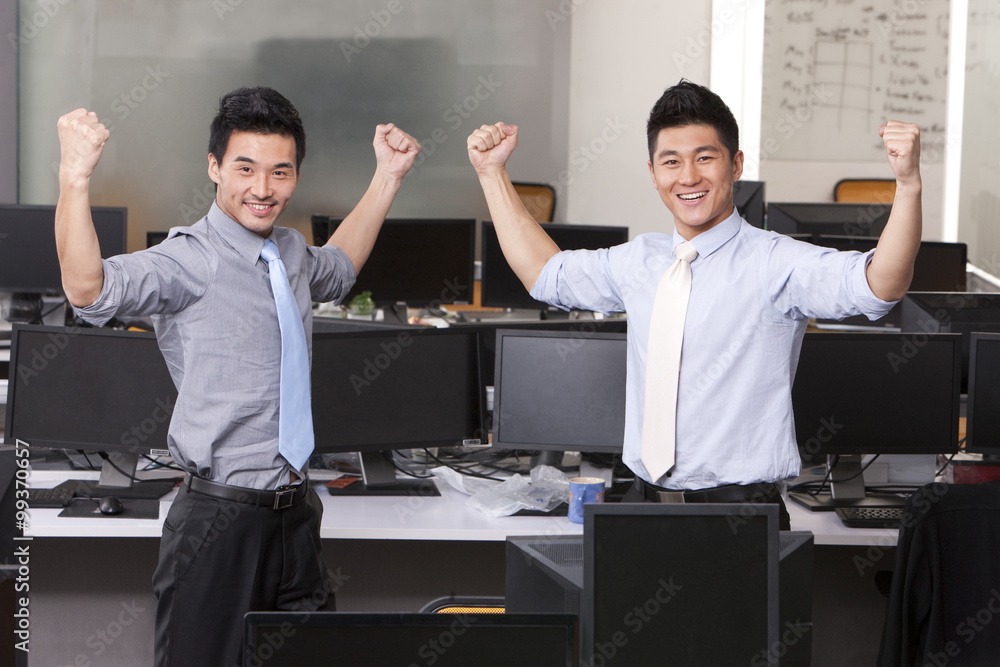 Businessmen flexing their muscles