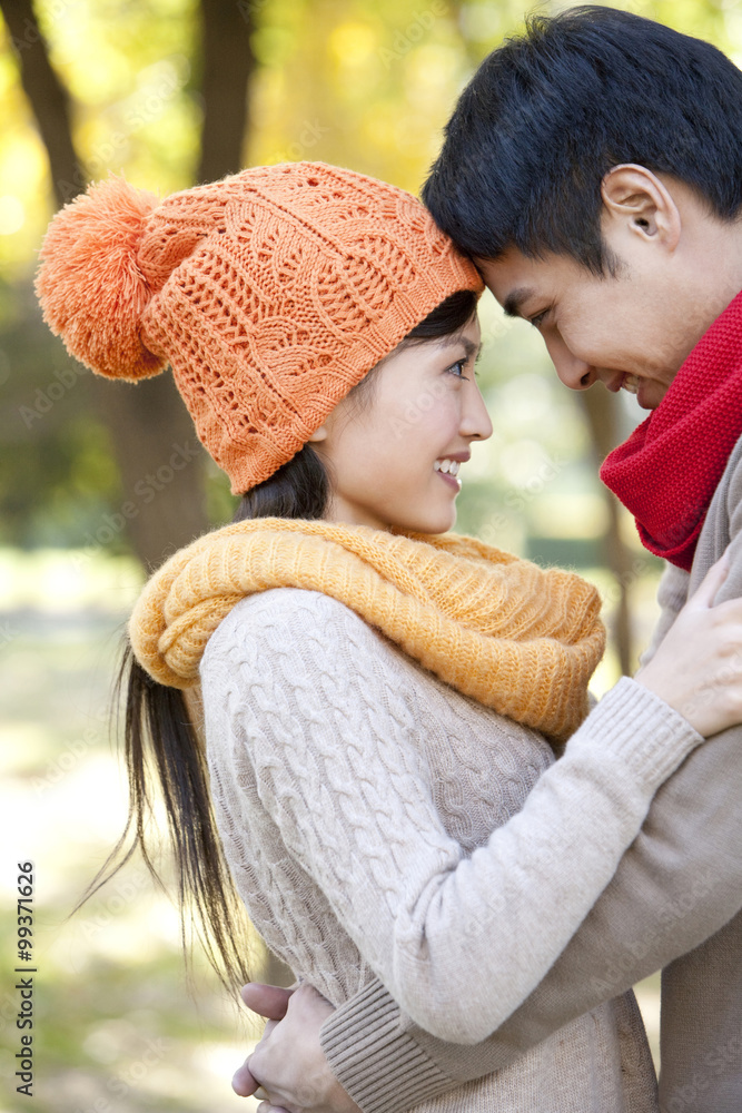 Young Couple in a Park in Autumn