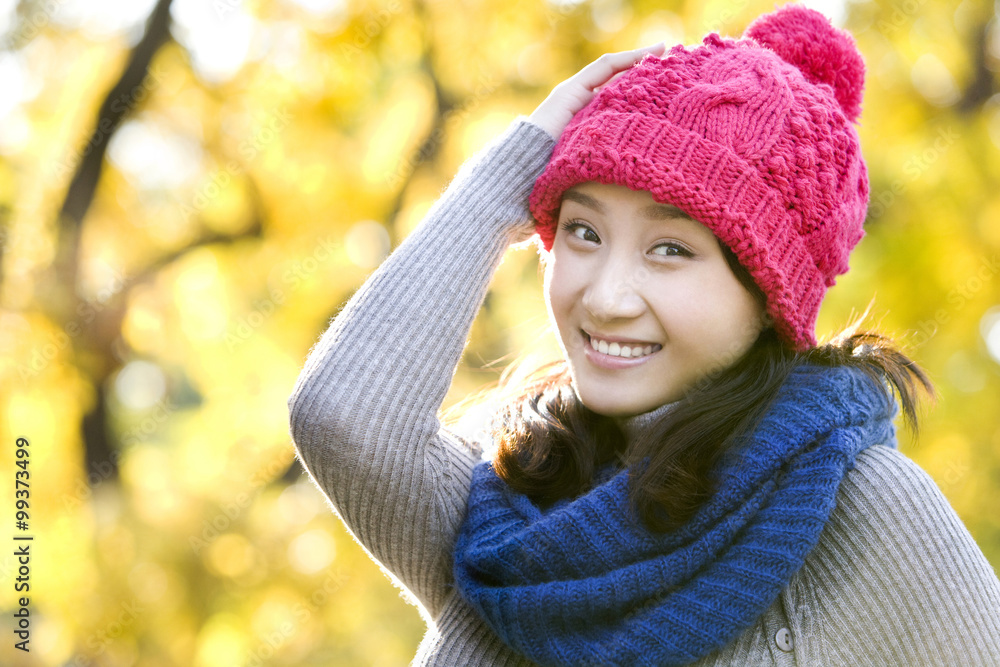 Young Woman in a Park in Autumn