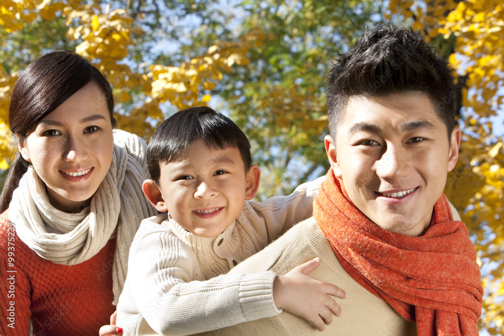 Young family in a park in Autumn