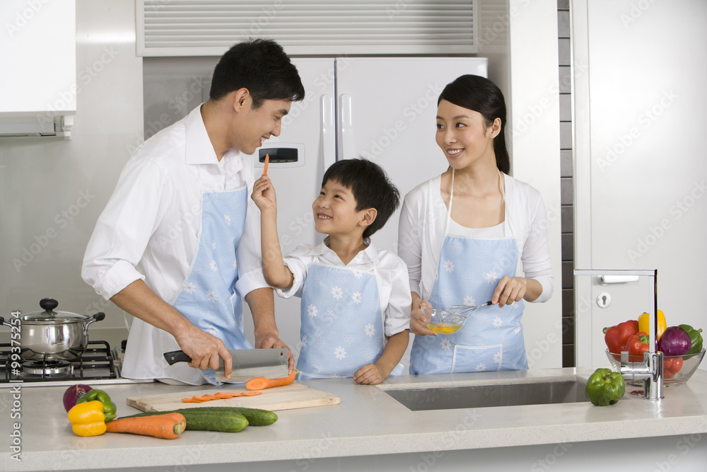 Family cooking in kitchen