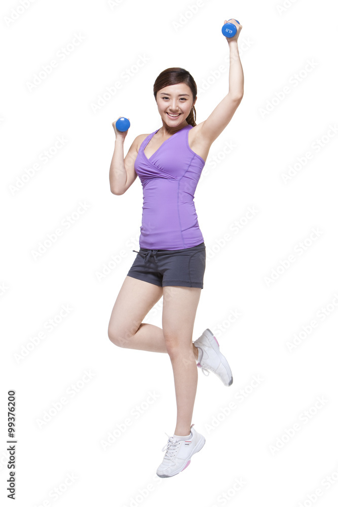 Young woman lifting weights