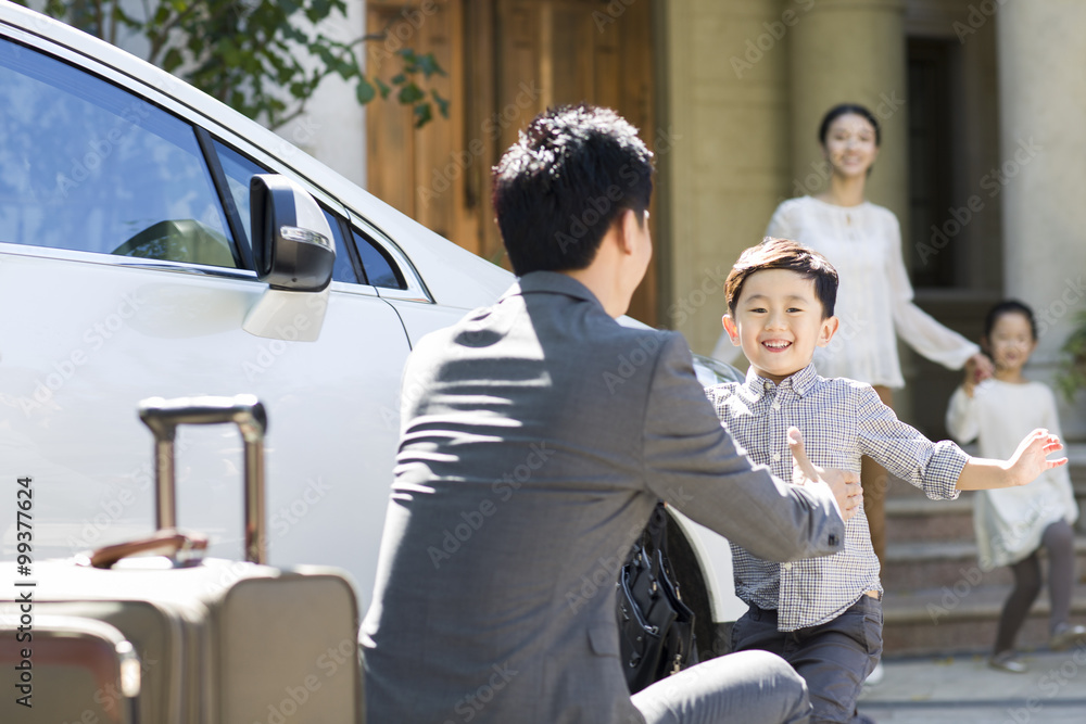 Son greeting returning father