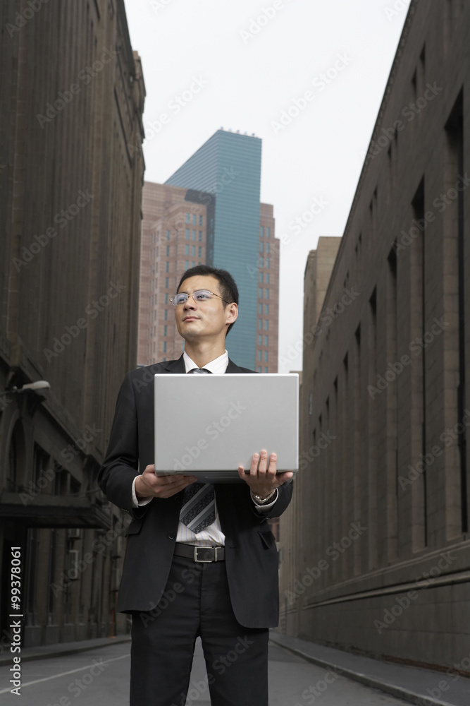 Portrait Of Businessman With Computer