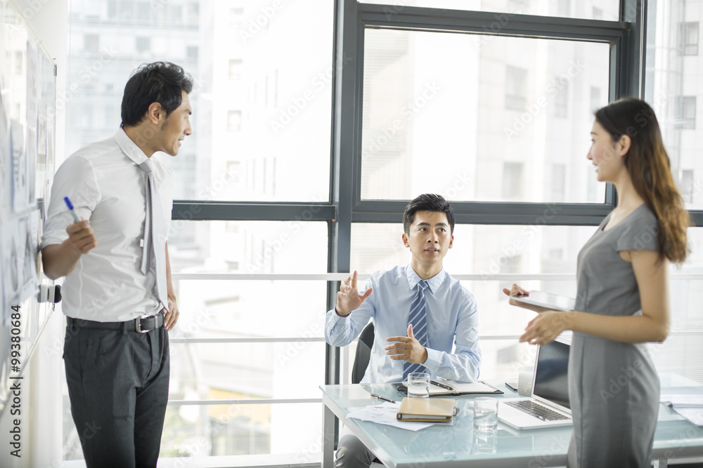 Young business people talking in meeting