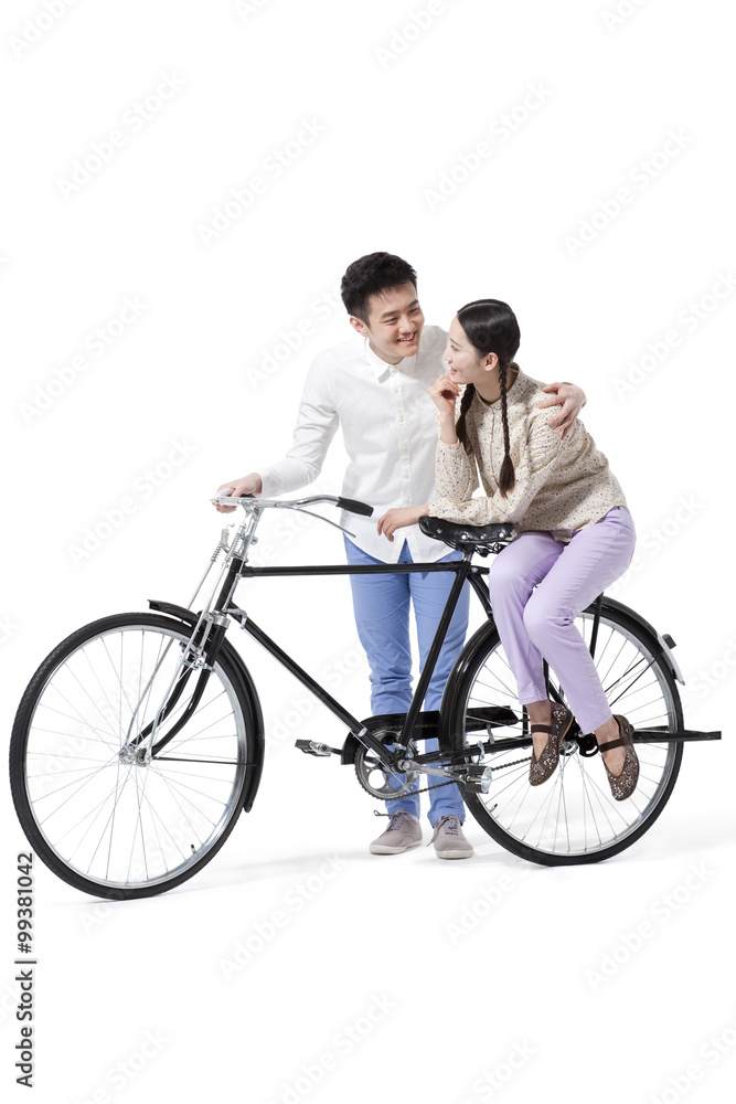 Retro couple with an old-fashioned bicycle