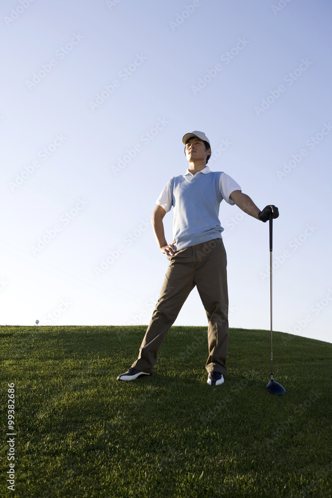 Golfer taking a rest on the course