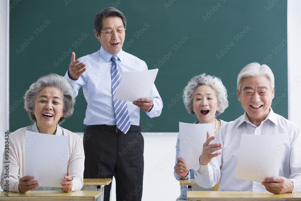 Senior adults having music class at school