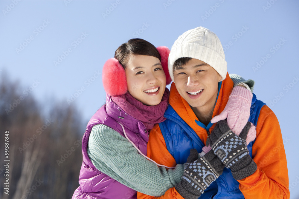 Happy young couple in ski resort