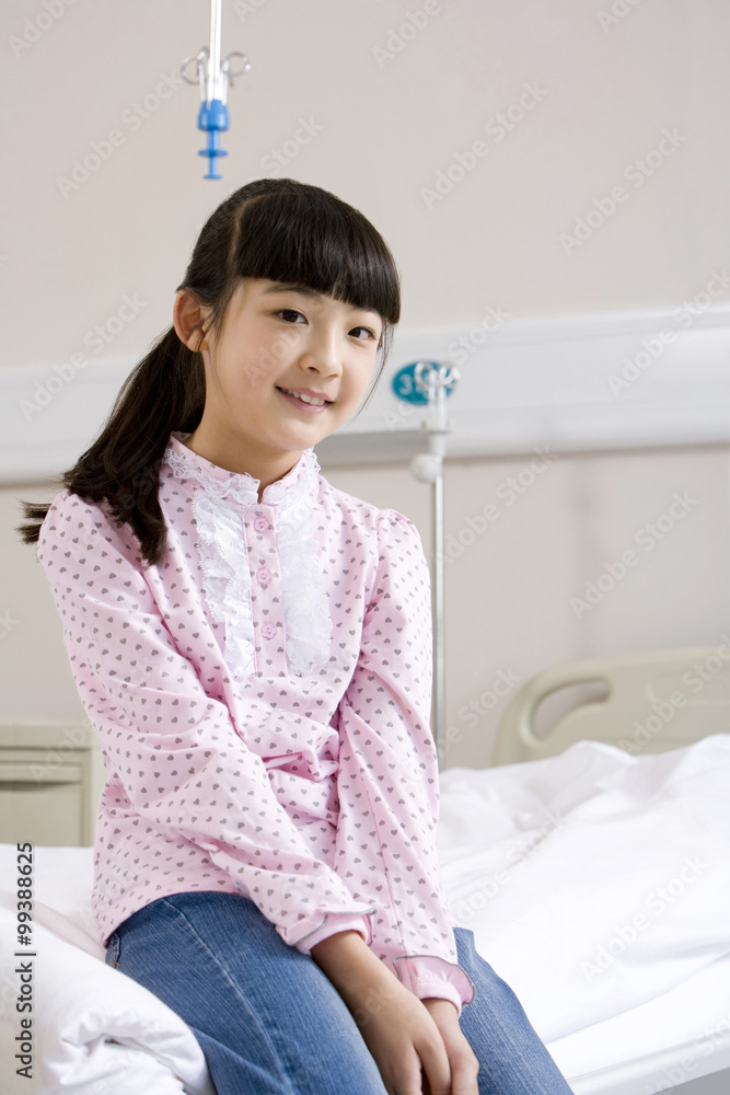 Portrait of a girl sitting on a hospital bed