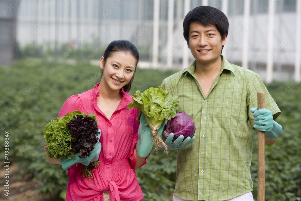 Young couple gardening in farm