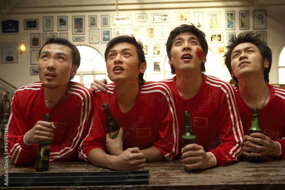 Patriotic Young Men Leaning On Bar Together