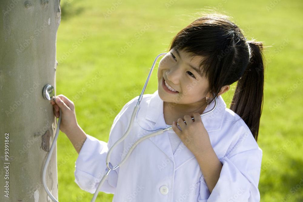 Young girl giving a tree check-up