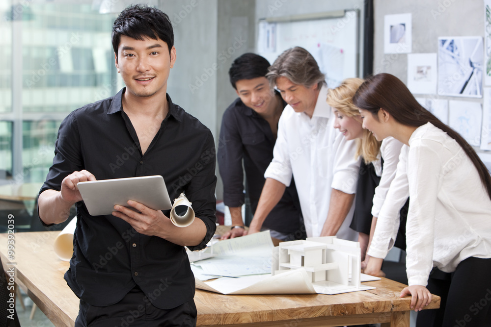  Architect using digital tablet in studio