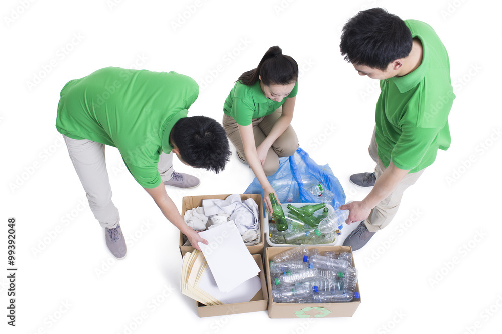 Happy volunteers recycling