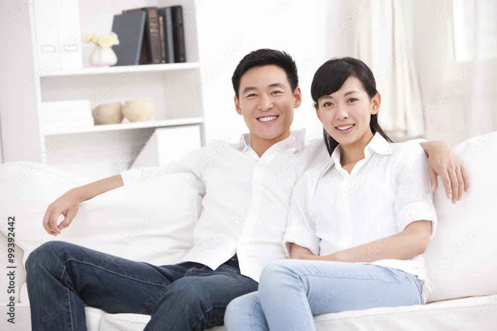 Young couple sitting in sofa