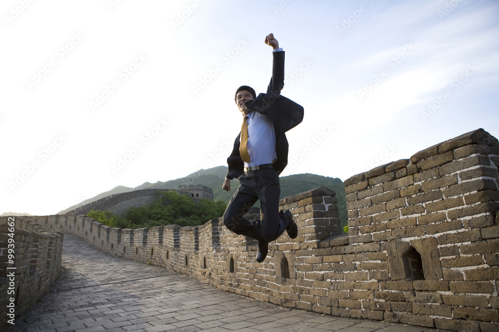 Happy businessman on the Great Wall