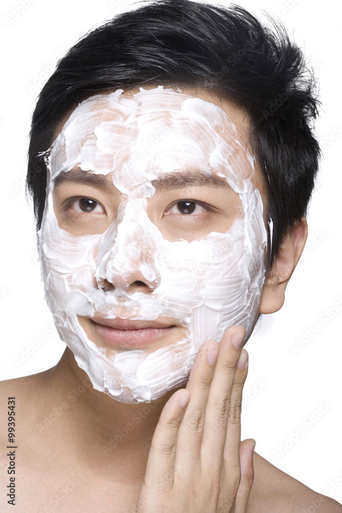 Handsome young man with facial mask