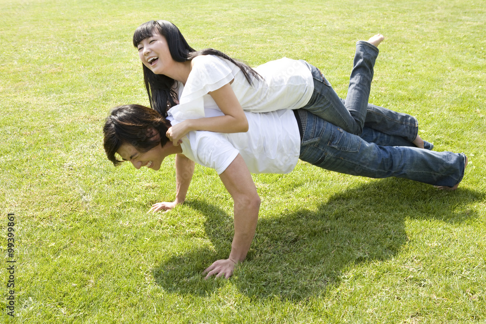 Young couple having fun in park