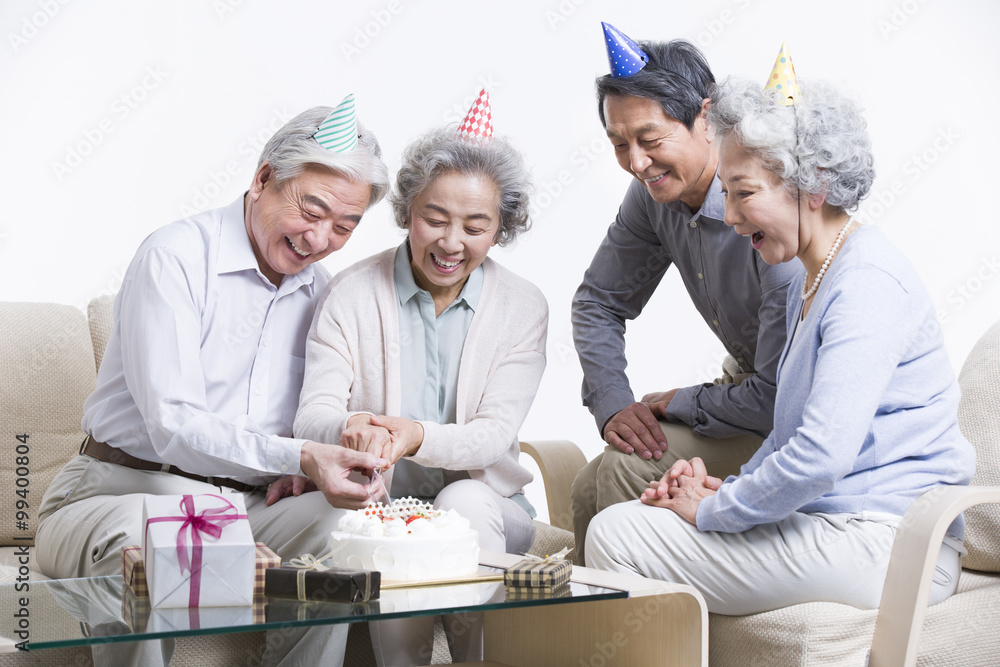 Senior adults having birthday party