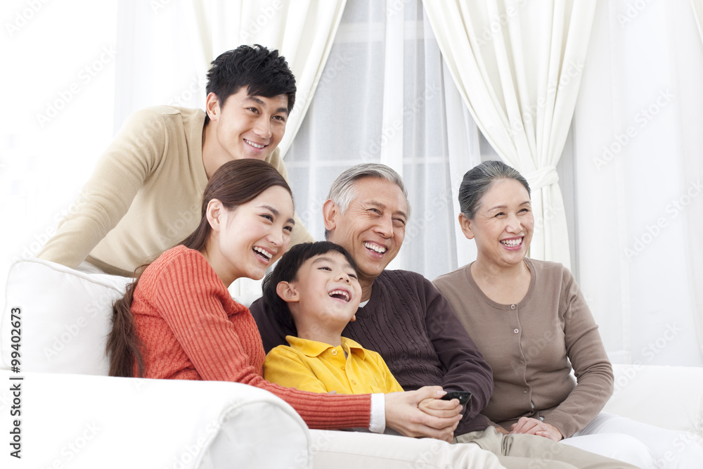 Family watching TV together